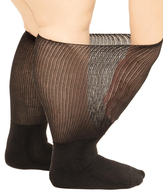 Gooi extra wide black diabetic socks, knee-high, worn on wide swollen calves, white background