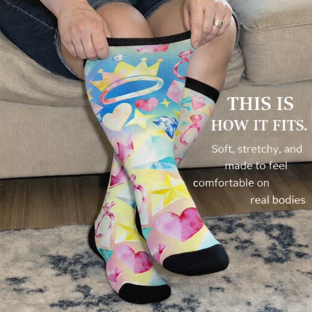 Woman stretching the cuff of Gooi Crown Heart extra wide socks, soft stretchy non-binding fit