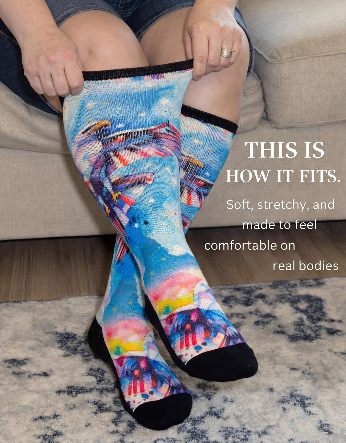 Woman stretching the cuff of Gooi Eagle Freedom extra wide socks, soft stretchy non-binding fit