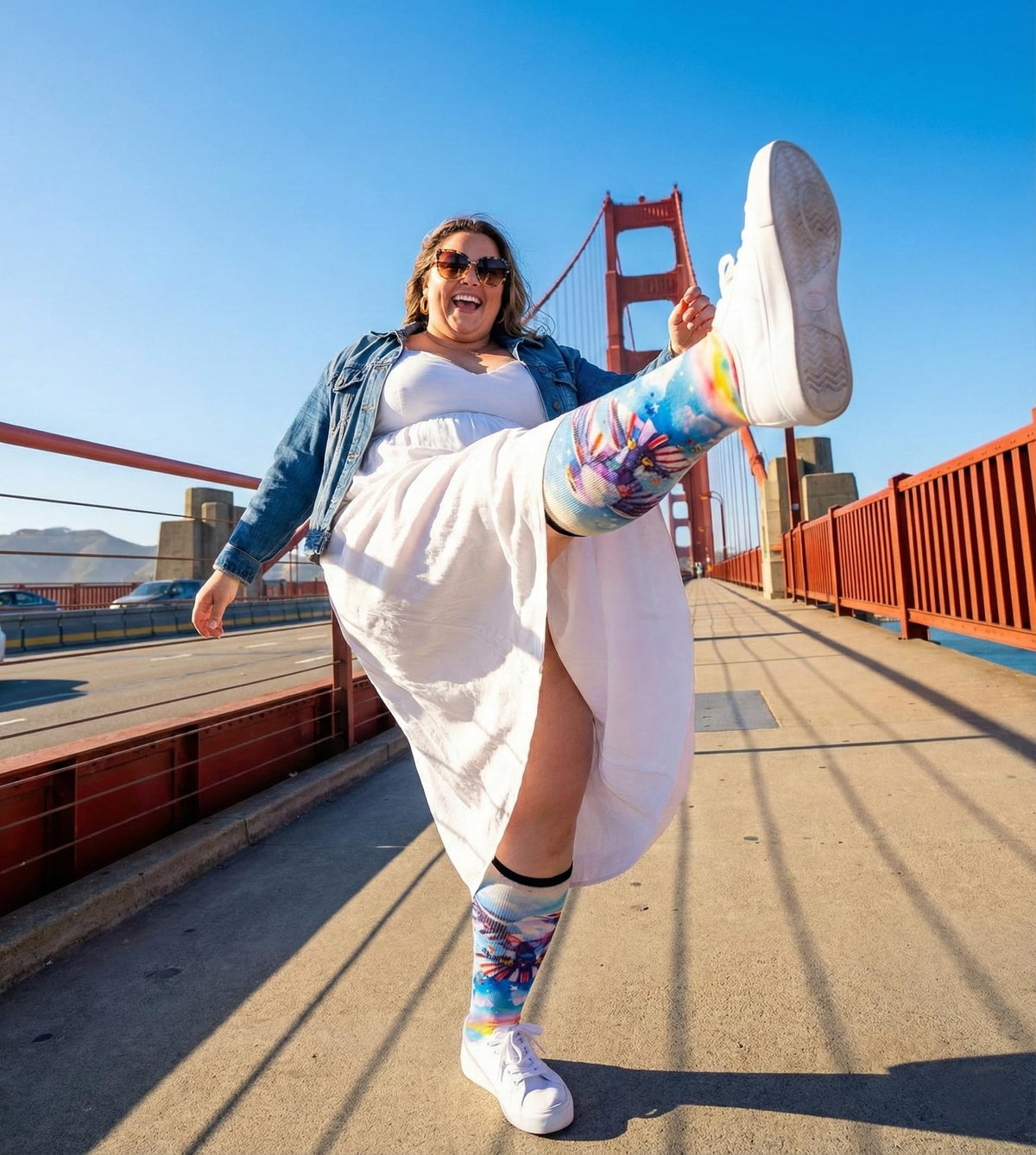 Woman kicking on the Golden Gate Bridge in Gooi Eagle Freedom extra wide socks that stay up
