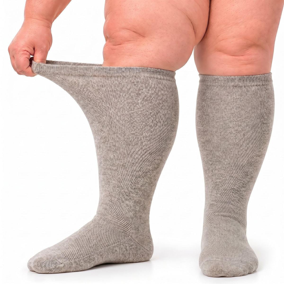 Gooi extra wide gray knee-high socks, 1 pair, cuff stretched open on swollen legs