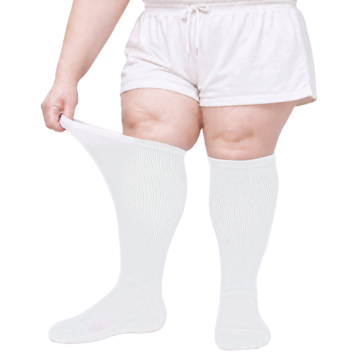 Gooi extra wide white knee-high socks, 1 pair, cuff stretched open on swollen legs